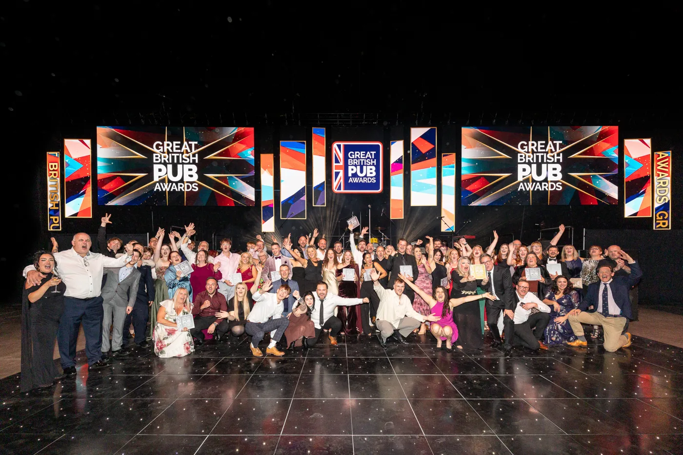 Winners from across the Great British Pub Awards 2026 gathered on the stage floor in Leeds, many holding trophies